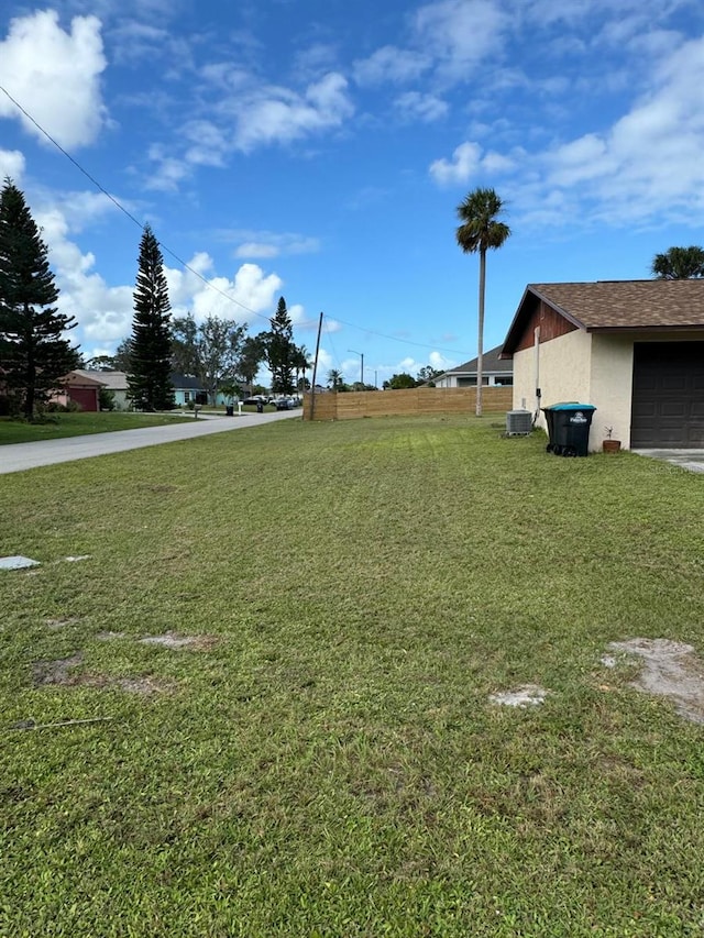 view of yard with a garage