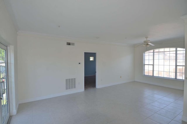 4336 Bayside Village Dr Unit 201, Tampa, FL 33615 - empty room featuring a ceiling fan, ornamental molding, and light tile patterned floors