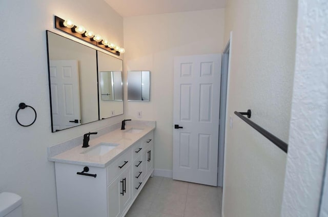 4336 Bayside Village Dr Unit 201, Tampa, FL 33615 - bathroom featuring double vanity and tile patterned flooring
