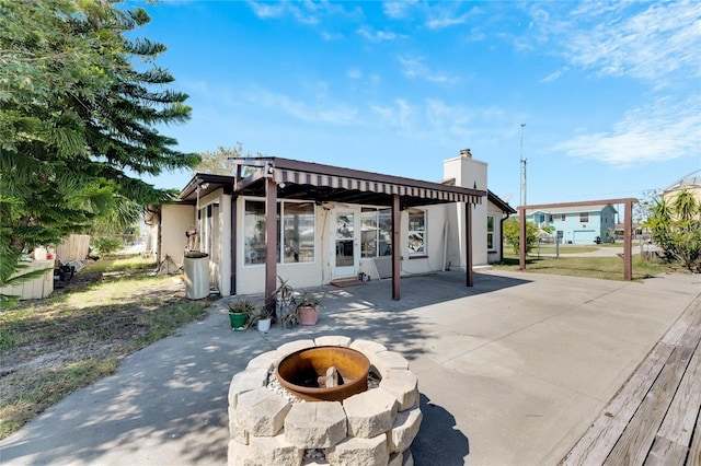 view of patio / terrace with a fire pit