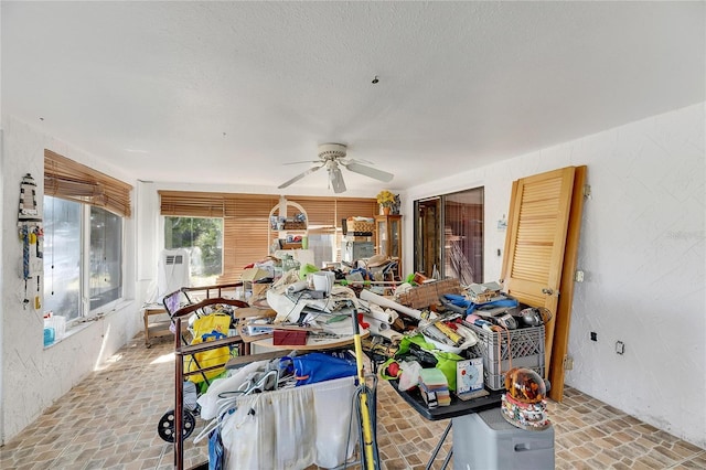 interior space featuring ceiling fan