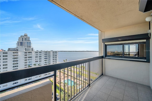 balcony featuring a water view