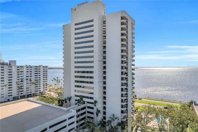 view of building exterior with a water view