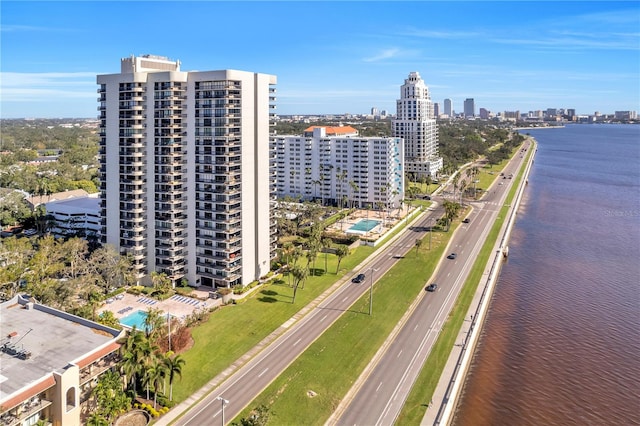 birds eye view of property with a water view