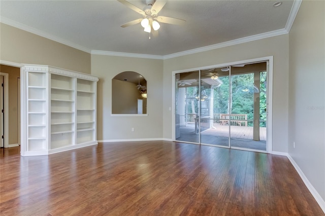 spare room with ceiling fan, crown molding, a textured ceiling, and dark hardwood / wood-style floors