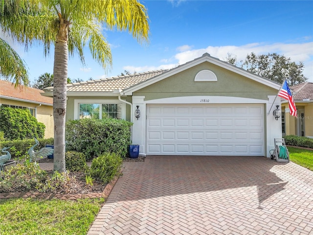 single story home featuring a garage