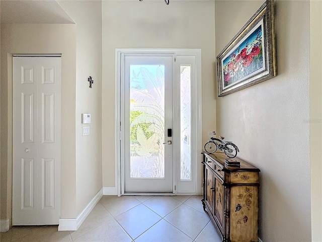 entryway with light tile patterned flooring