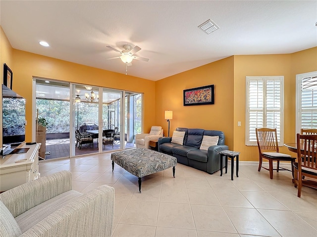 living room featuring ceiling fan and light tile patterned floors