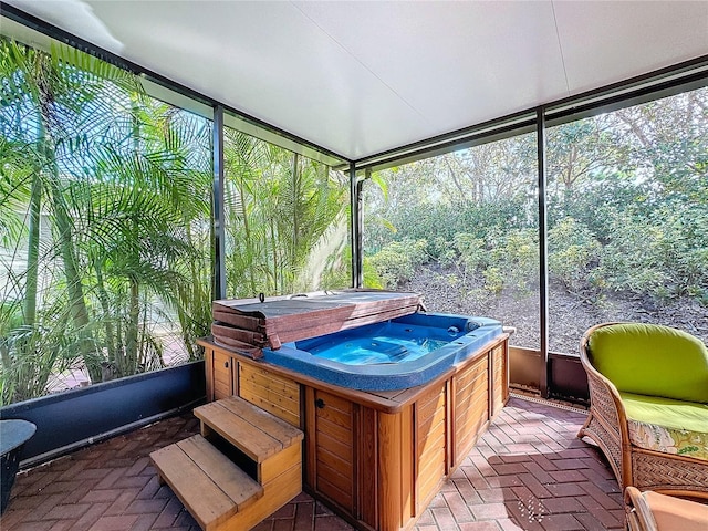 sunroom with a jacuzzi