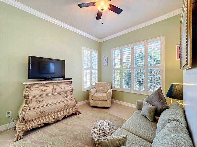 15810 Cobble Mill Dr, Wimauma, FL 33598 - living room with crown molding, ceiling fan, baseboards, healthy amount of natural light, and light tile patterned floors