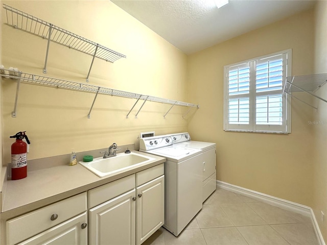 15810 Cobble Mill Dr, Wimauma, FL 33598 - laundry area with washer and dryer, baseboards, cabinet space, and light tile patterned flooring