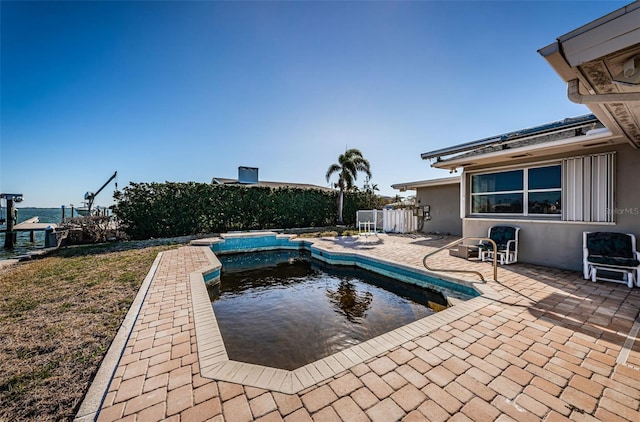 view of swimming pool featuring a patio area