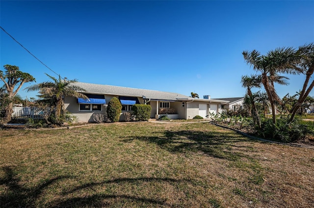 rear view of property with a yard