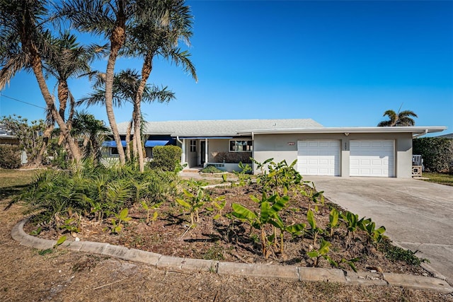 ranch-style house featuring a garage