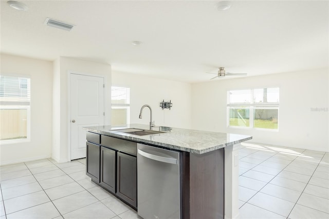 kitchen with a center island with sink, sink, light tile patterned floors, stainless steel dishwasher, and ceiling fan