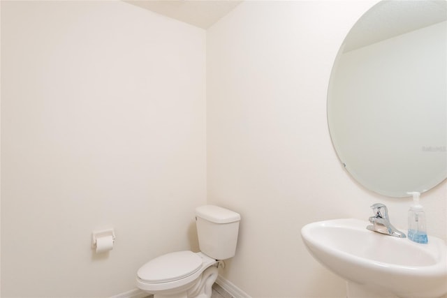 bathroom with toilet and sink