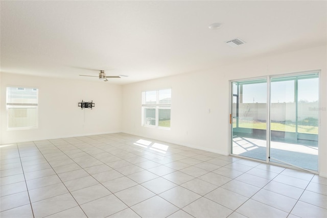 spare room featuring ceiling fan and light tile patterned floors