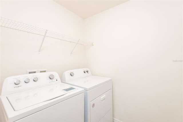 laundry room featuring separate washer and dryer