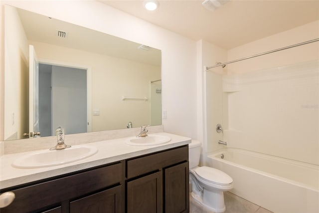 full bathroom featuring vanity, shower / washtub combination, toilet, and tile patterned floors