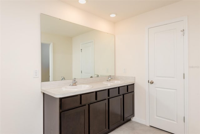 bathroom with vanity and tile patterned flooring