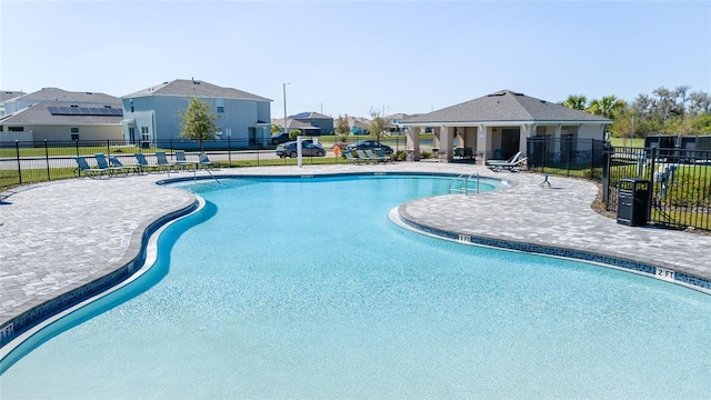 view of swimming pool featuring a patio area