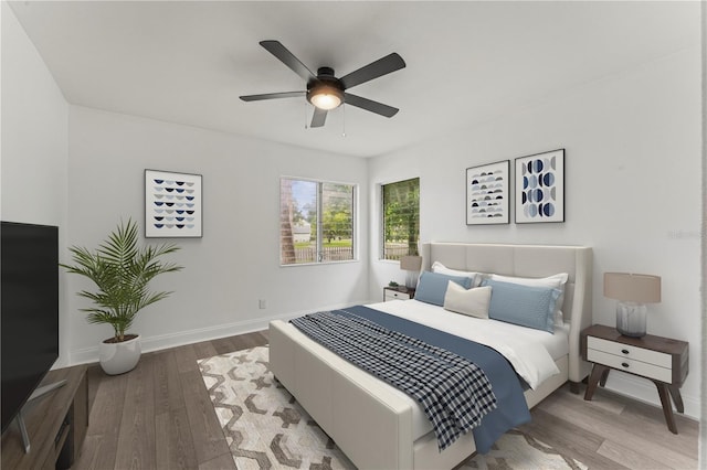 bedroom featuring ceiling fan and hardwood / wood-style flooring