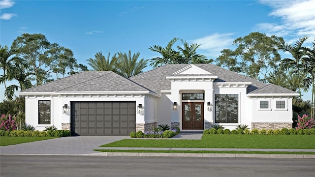 view of front of home featuring a front yard and a garage