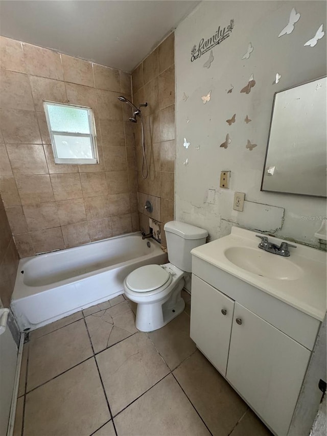 full bathroom featuring vanity, tiled shower / bath combo, toilet, and tile patterned flooring