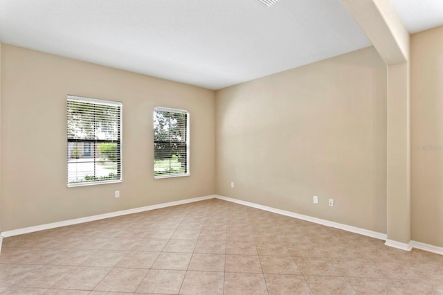 3320 Majestic View Dr, Lutz, FL 33558 - empty room with light tile patterned floors and baseboards
