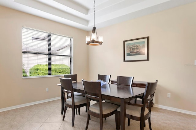 3320 Majestic View Dr, Lutz, FL 33558 - dining room featuring light tile patterned floors, a raised ceiling, baseboards, and a chandelier