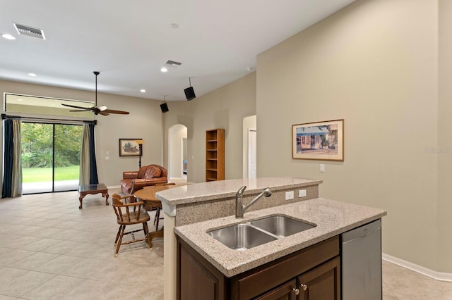 3320 Majestic View Dr, Lutz, FL 33558 - kitchen with stainless steel dishwasher, a sink, arched walkways, a ceiling fan, and open floor plan