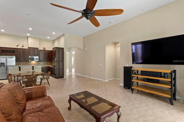3320 Majestic View Dr, Lutz, FL 33558 - living area featuring arched walkways, a ceiling fan, light tile patterned flooring, recessed lighting, and baseboards
