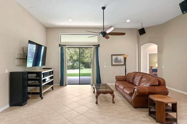 3320 Majestic View Dr, Lutz, FL 33558 - living room featuring arched walkways, ceiling fan, light tile patterned floors, recessed lighting, and baseboards