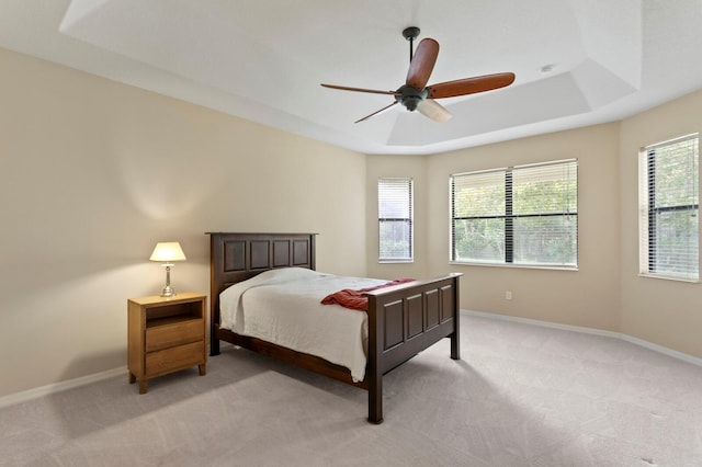 3320 Majestic View Dr, Lutz, FL 33558 - bedroom featuring light colored carpet, a raised ceiling, baseboards, and a ceiling fan