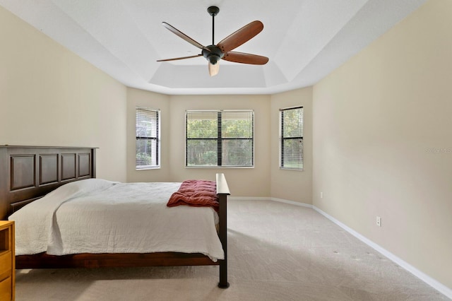 3320 Majestic View Dr, Lutz, FL 33558 - carpeted bedroom with a tray ceiling, baseboards, and ceiling fan