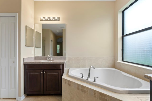 3320 Majestic View Dr, Lutz, FL 33558 - bathroom featuring vanity, a garden tub, a closet, and healthy amount of natural light