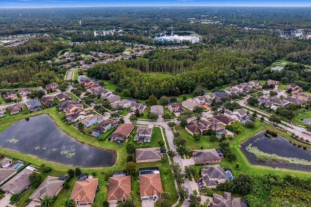 3320 Majestic View Dr, Lutz, FL 33558 - aerial view of property's location with a nearby body of water, nearby suburban area, and a heavily wooded area