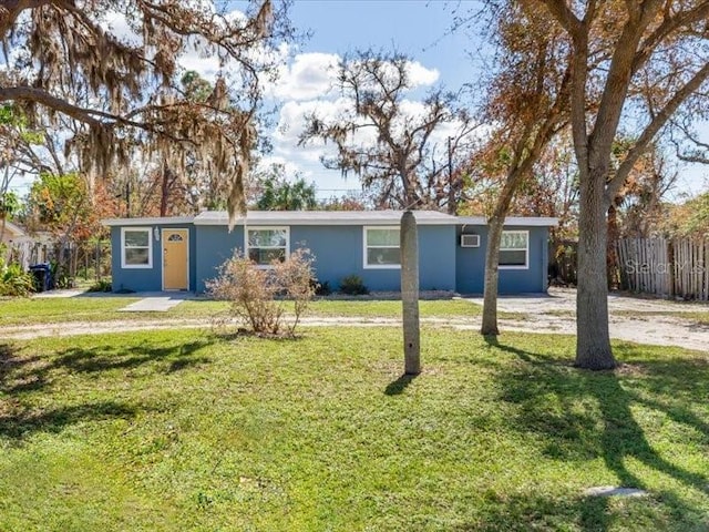 single story home featuring a front lawn