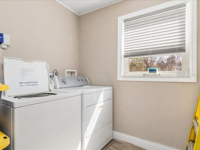 clothes washing area with washer and dryer