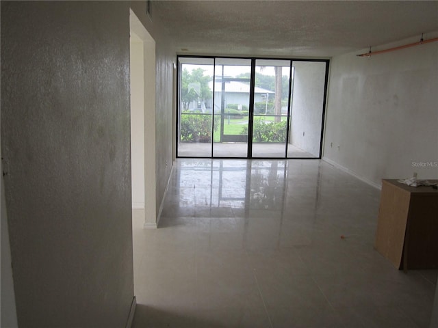 empty room featuring expansive windows