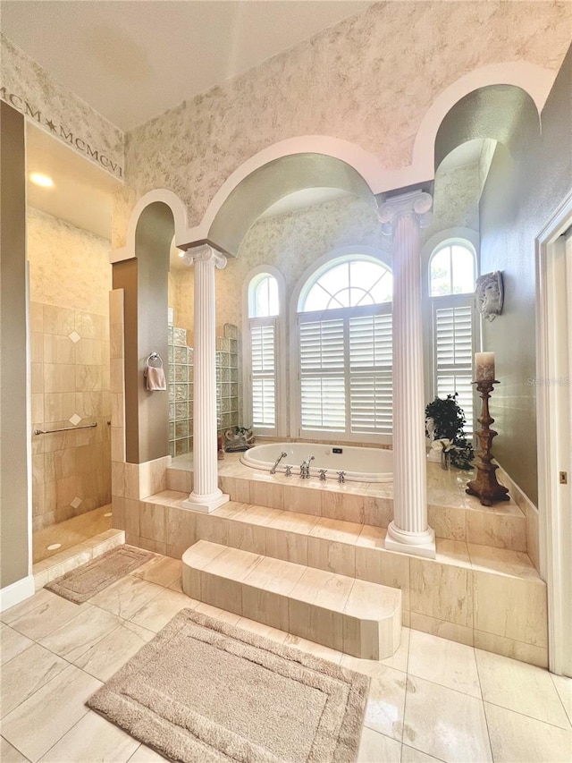 bathroom featuring separate shower and tub and ornate columns