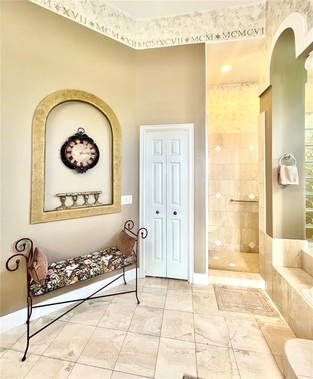 bathroom with a tile shower