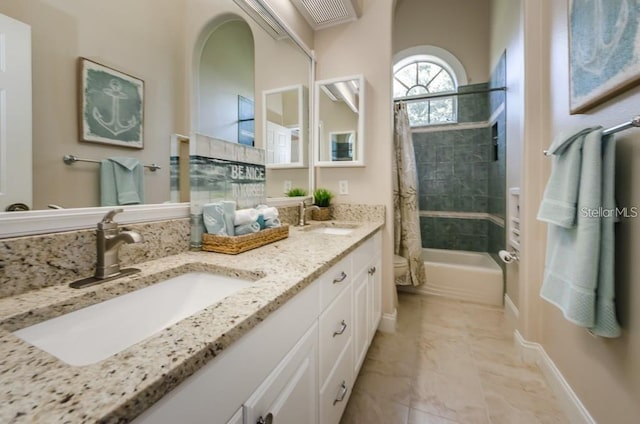 bathroom with vanity and shower / bath combo with shower curtain