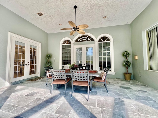 view of patio / terrace with ceiling fan and french doors