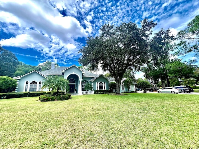 single story home with a front yard