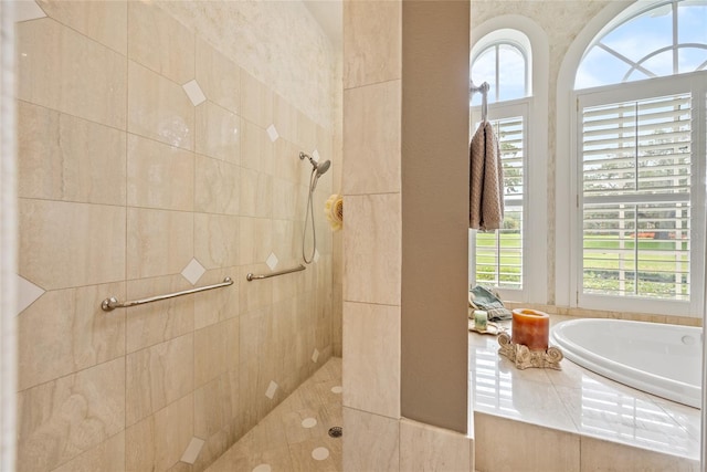 168 Rue Des Chateaux, Tarpon Springs, FL 34688 - bathroom with plenty of natural light, a tile shower, and a garden tub