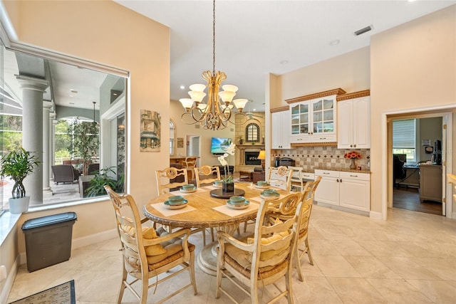 168 Rue Des Chateaux, Tarpon Springs, FL 34688 - dining space with a chandelier, light tile patterned flooring, and recessed lighting