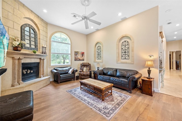 168 Rue Des Chateaux, Tarpon Springs, FL 34688 - living area featuring a ceiling fan, wood finished floors, a premium fireplace, and recessed lighting