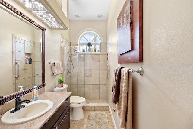 168 Rue Des Chateaux, Tarpon Springs, FL 34688 - bathroom featuring a shower stall, vanity, and tile patterned floors