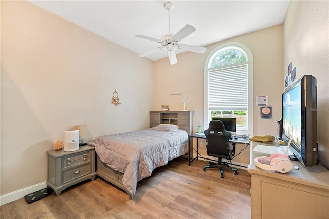 168 Rue Des Chateaux, Tarpon Springs, FL 34688 - bedroom with light wood-type flooring, an office area, and a ceiling fan